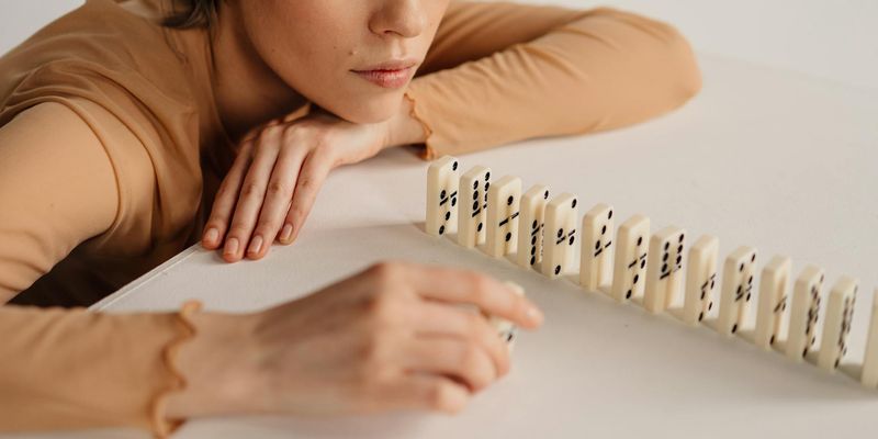 Close-up of a person's hands in a mindful gesture.